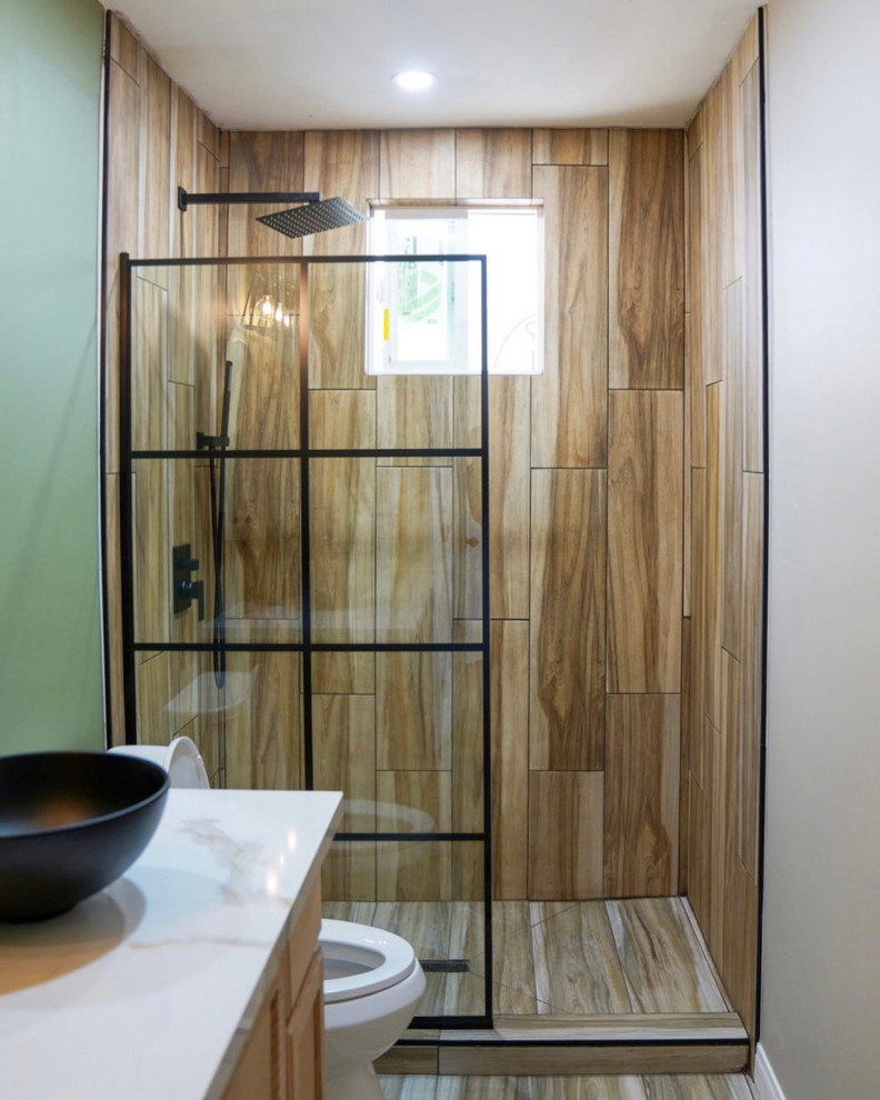 Modern bathroom in San Diego with shaker cabinets, light wood cabinets, an open shower, a one-piece toilet, green tile, wood-look tile, green walls, light hardwood floors, granite benchtops, an open shower, white benchtops, a single vanity and a floating vanity.