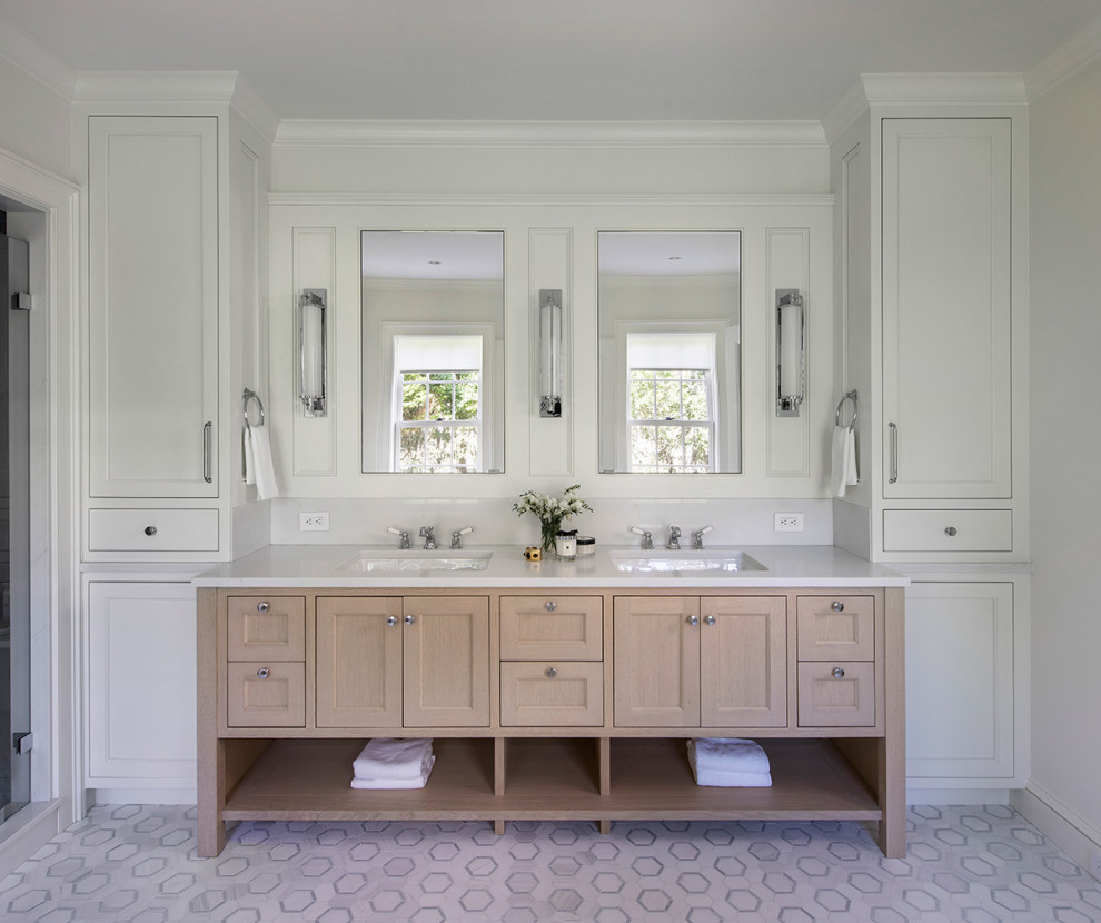 Photo of a beach style bathroom in Providence with recessed-panel cabinets, light wood cabinets, white walls, mosaic tile floors, an undermount sink, white floor, white benchtops, a double vanity and a built-in vanity.