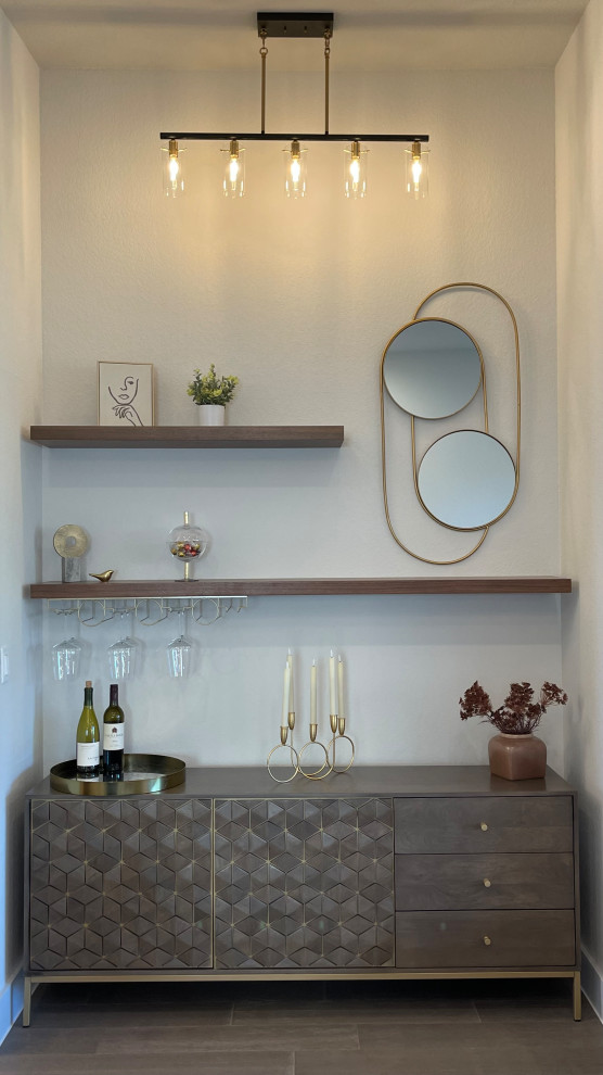 Inspiration for a small modern single-wall home bar in Austin with beaded inset cabinets, grey cabinets, wood benchtops, light hardwood floors, grey floor and grey benchtop.