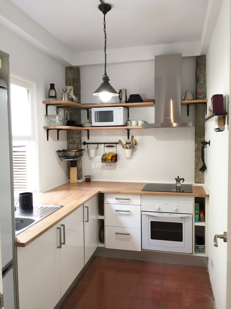 Inspiration for a small scandinavian l-shaped separate kitchen in Other with an undermount sink, flat-panel cabinets, white cabinets, wood benchtops, white splashback, white appliances and no island.