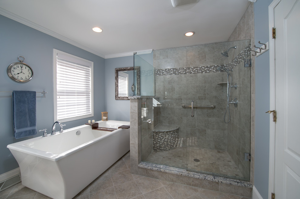 Design ideas for a large transitional master bathroom in Boston with an undermount sink, furniture-like cabinets, dark wood cabinets, granite benchtops, a freestanding tub, an open shower, a two-piece toilet, gray tile, porcelain tile, blue walls and porcelain floors.