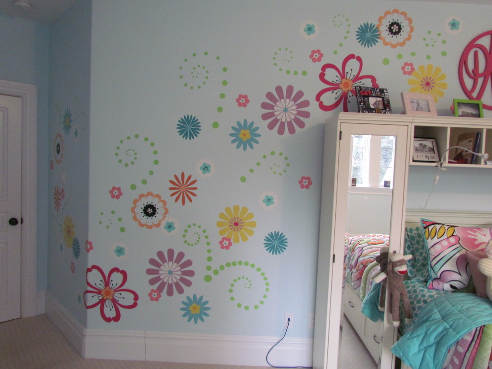 This is an example of a transitional kids' room for girls in Philadelphia with blue walls and carpet.