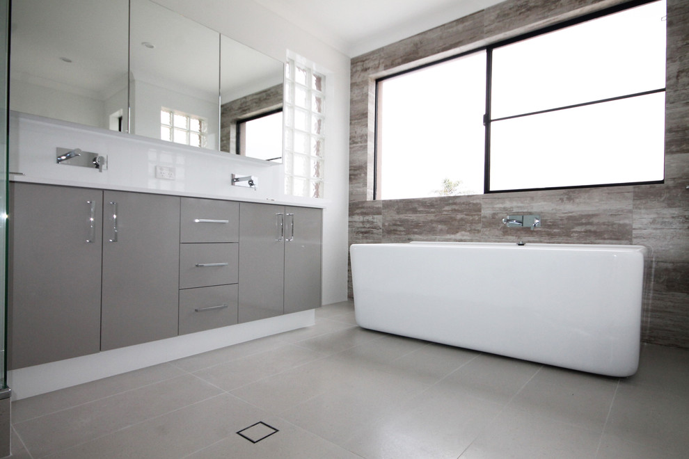 Large modern bathroom in Perth with an undermount sink, flat-panel cabinets, brown cabinets, a freestanding tub, brown tile, ceramic tile, white walls and ceramic floors.