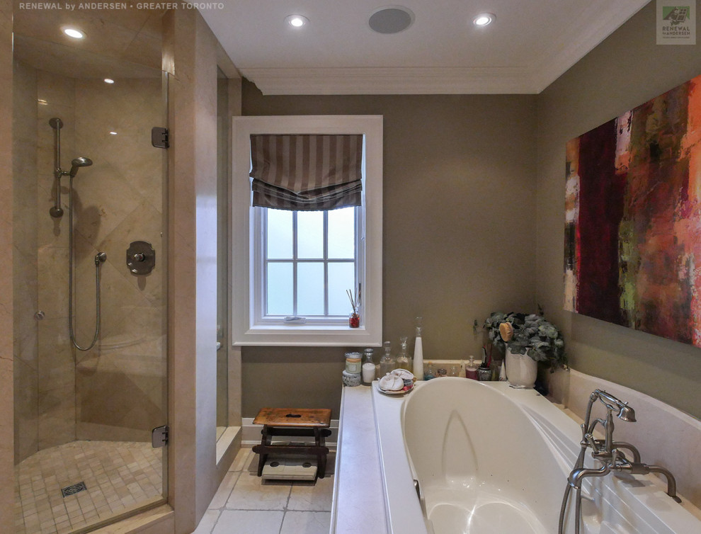 Photo of a large master bathroom in Toronto with beige cabinets, a hot tub, a corner shower, a two-piece toilet, beige tile, stone tile, beige walls, bamboo floors, granite benchtops, beige floor, a hinged shower door, beige benchtops, a double vanity and a built-in vanity.