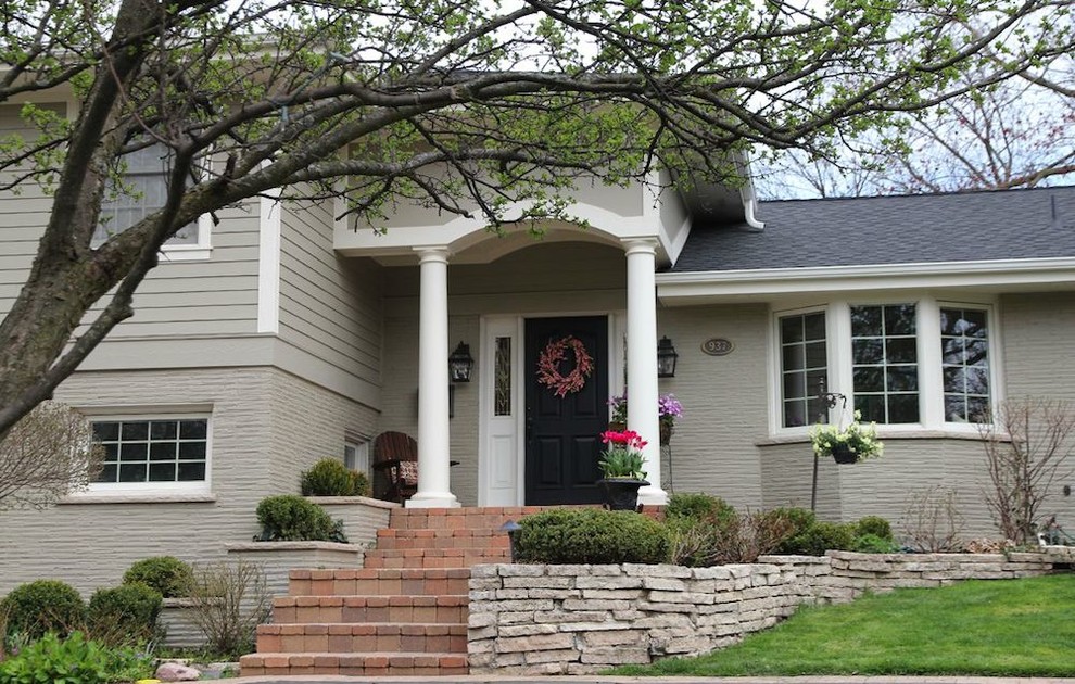 Example of a small transitional green split-level mixed siding exterior home design in Chicago