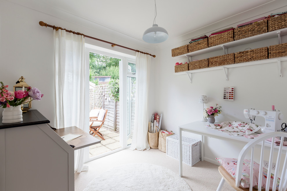 Inspiration for a small country craft room in London with white walls, carpet, no fireplace and a freestanding desk.