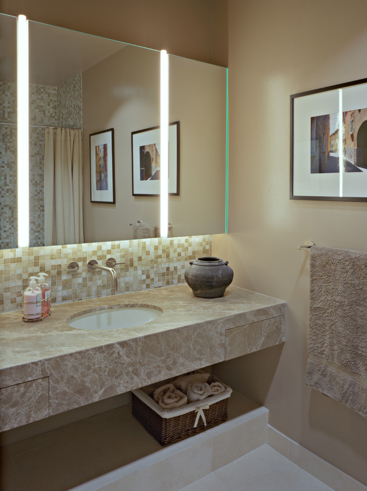 Photo of a mid-sized modern master bathroom in New York with open cabinets, an alcove shower, beige tile, mosaic tile, beige walls, slate floors, marble benchtops, an undermount sink and white floor.