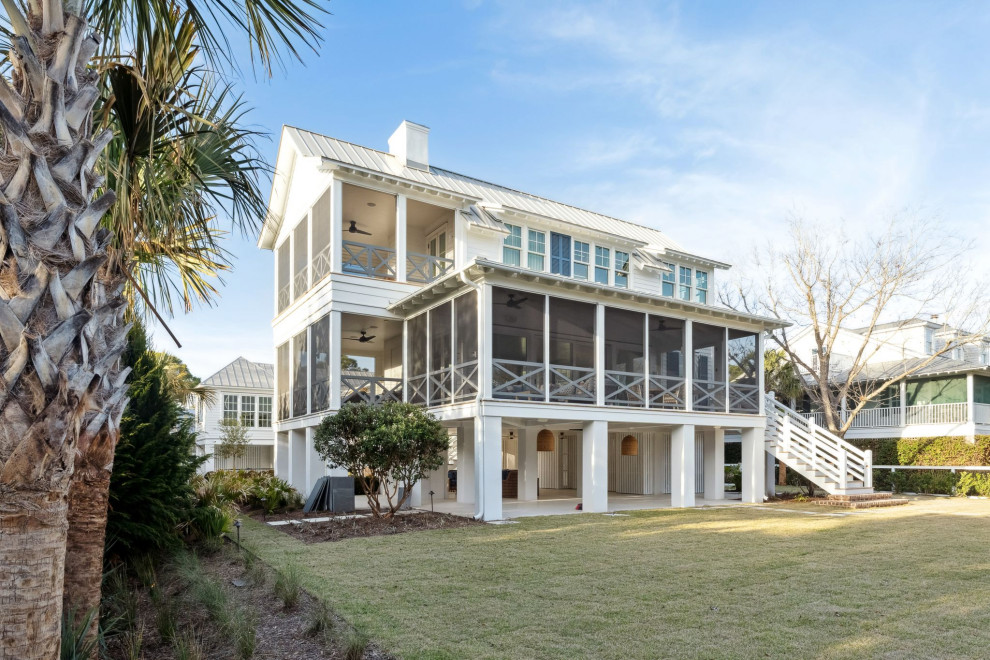 Historic Sea Cabins - Sullivan's Island beach house, highlighting the restored, existing historic sea cabin. Exterior is painted cedar lap siding with a hand-crimped metal roof in a light grey. The second story will offer ocean views