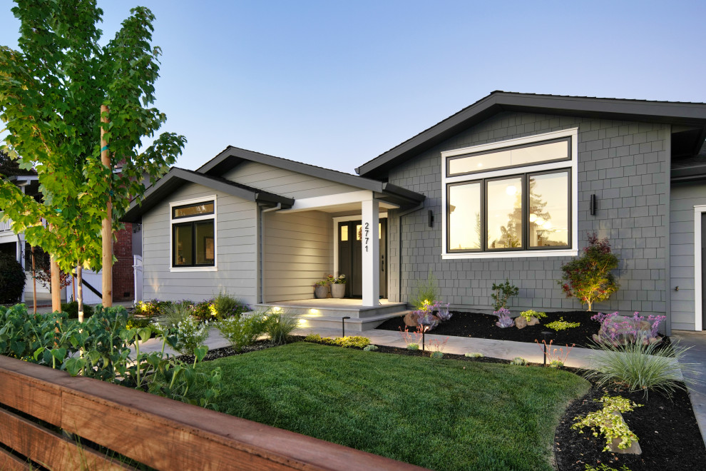 This is an example of a mid-sized contemporary one-storey grey house exterior in San Francisco with mixed siding, a gable roof, a shingle roof and a black roof.
