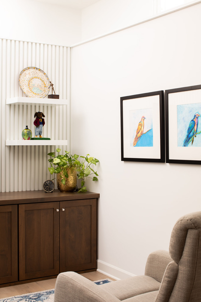 Inspiration for a mid-sized eclectic underground vinyl floor and brown floor basement remodel with white walls