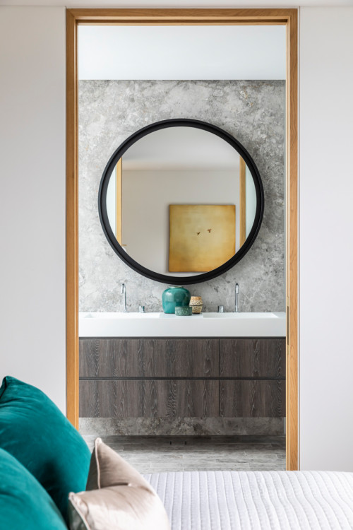Marble Drama: Marble Slab Backsplash and White Countertop for Wood Bathroom Vanity