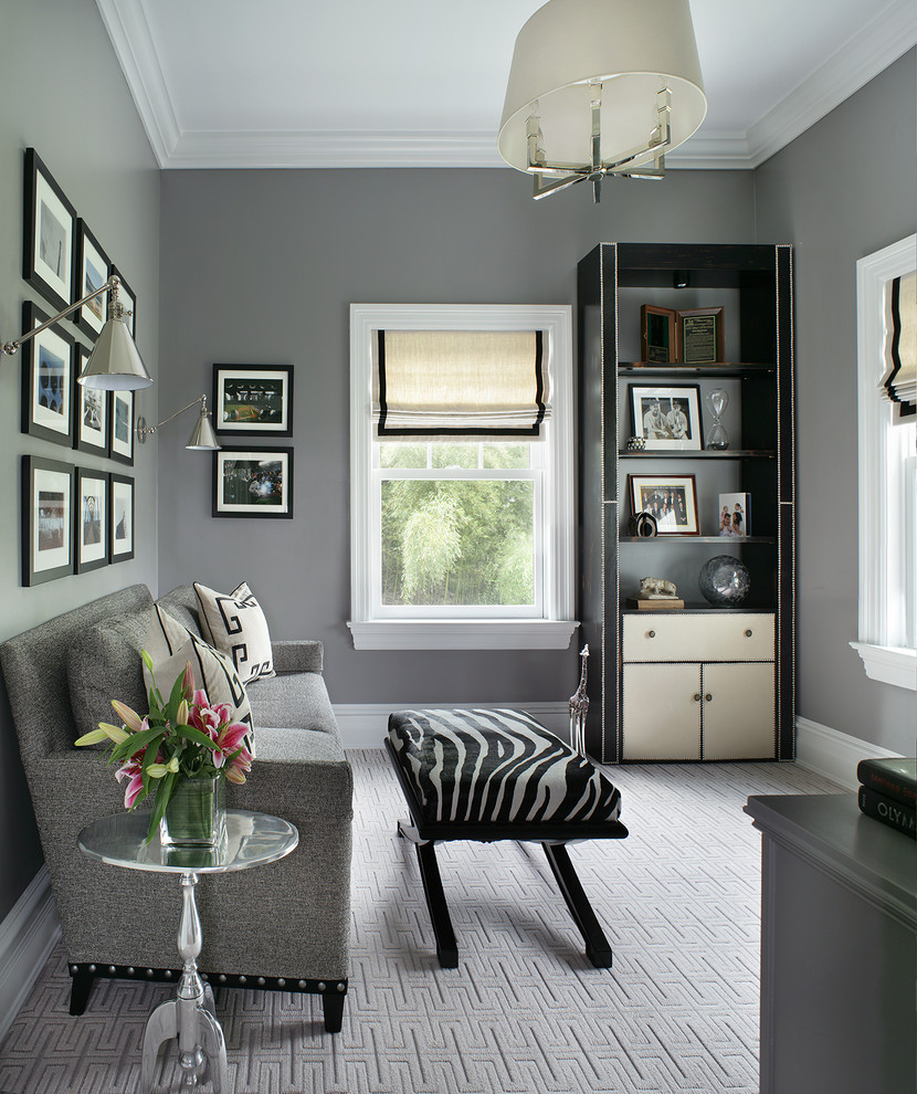 This is an example of a mid-sized transitional study room in New York with grey walls, carpet and no fireplace.