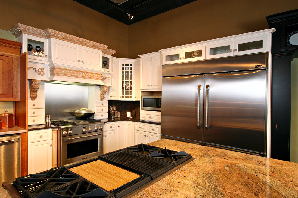 Inspiration for a mid-sized transitional l-shaped eat-in kitchen remodel in Minneapolis with white cabinets, marble countertops, multicolored backsplash, ceramic backsplash, stainless steel appliances and an island