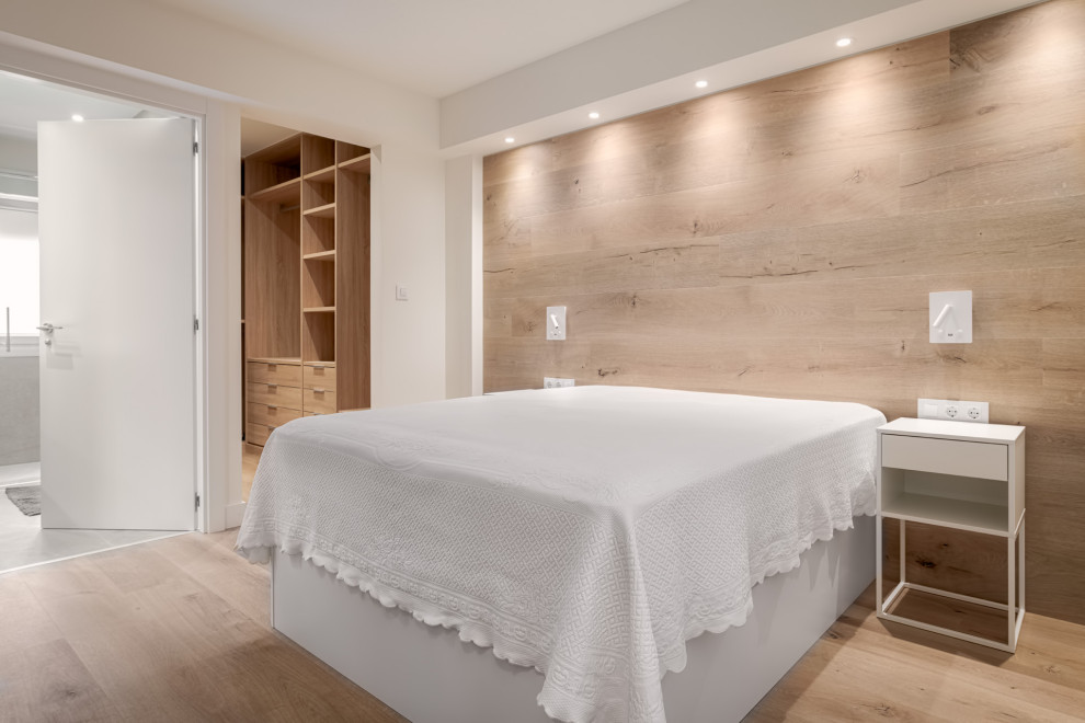 Bedroom - mid-sized contemporary master light wood floor and wood wall bedroom idea in Bilbao