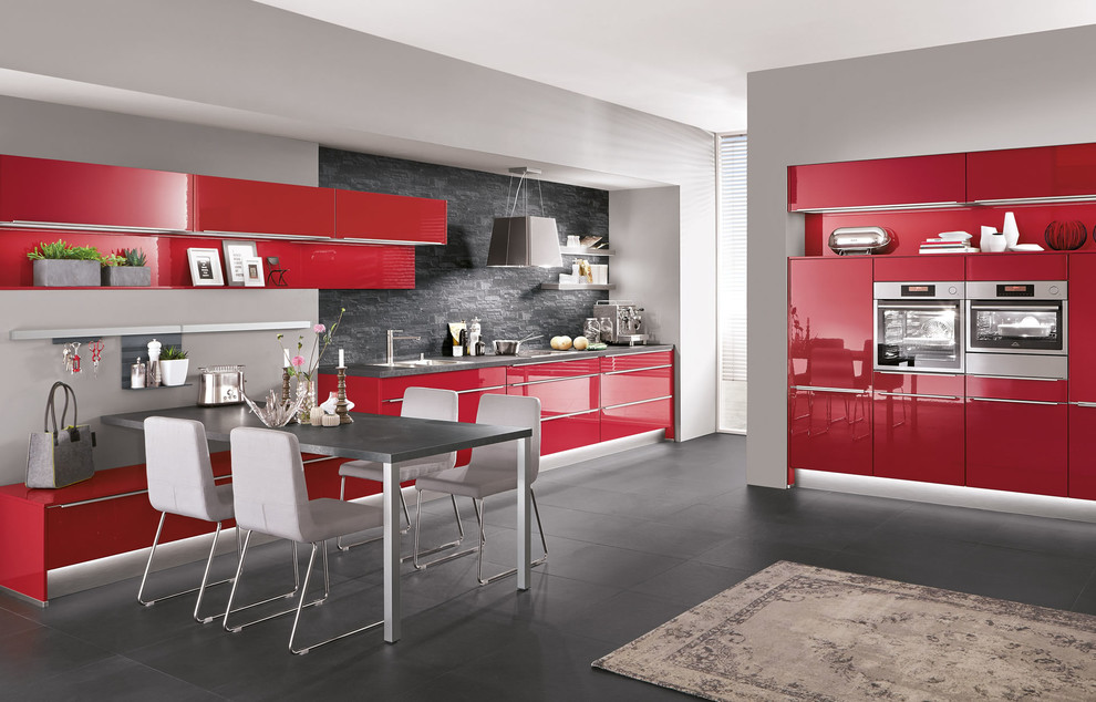 Design ideas for a large modern l-shaped eat-in kitchen in New York with flat-panel cabinets, red cabinets and no island.