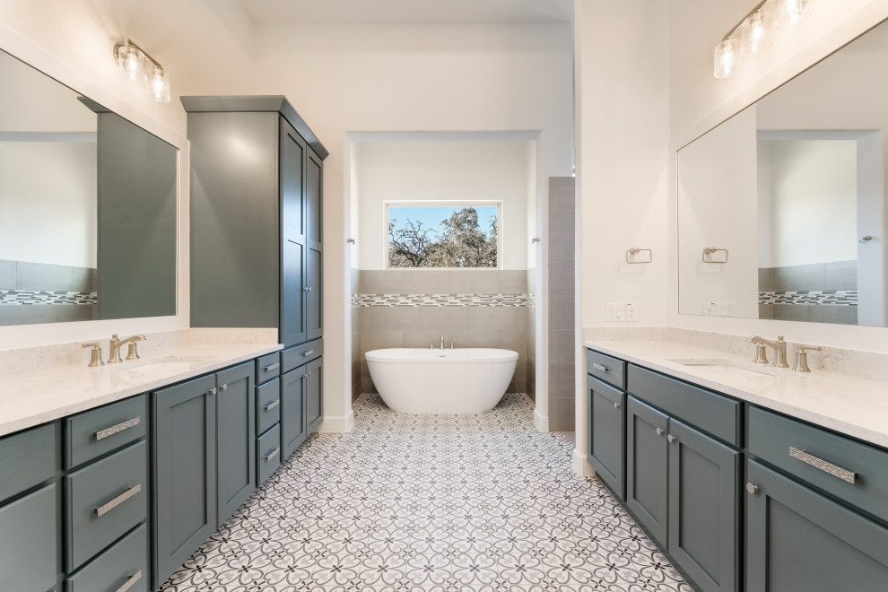 Design ideas for a large farmhouse ensuite bathroom in Austin with a freestanding bath, a walk-in shower, brown tiles, beige walls, multi-coloured floors, an open shower, flat-panel cabinets, green cabinets, a submerged sink, beige worktops, double sinks and a built in vanity unit.