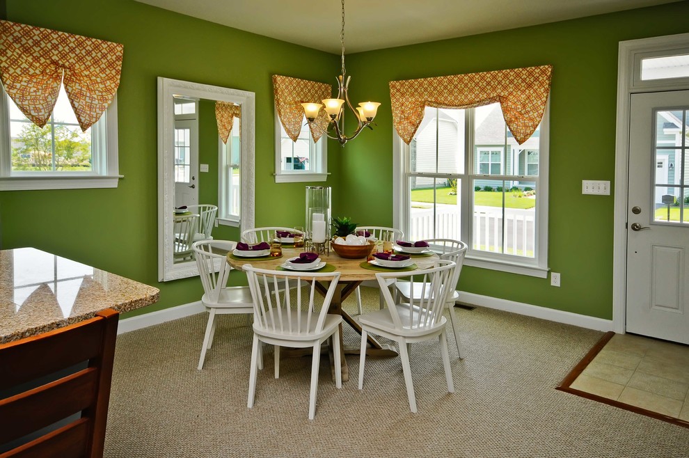 Design ideas for a beach style dining room in Other with green walls and carpet.