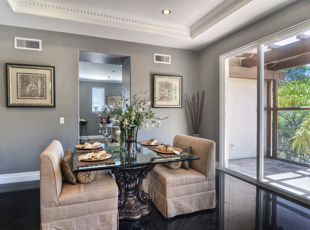 This is an example of a mid-sized contemporary separate dining room in Orange County with grey walls, porcelain floors and no fireplace.