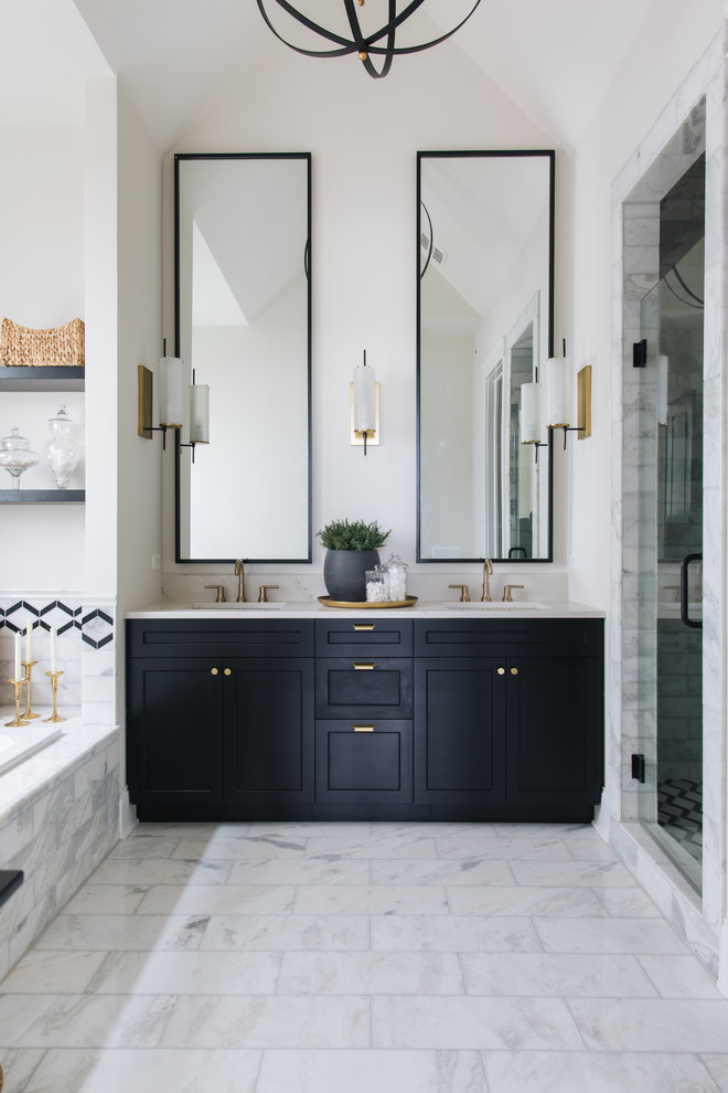 Design ideas for a country bathroom in Chicago with recessed-panel cabinets, black cabinets, a drop-in tub, an alcove shower, white tile, white walls, an undermount sink, white floor, a hinged shower door and white benchtops.
