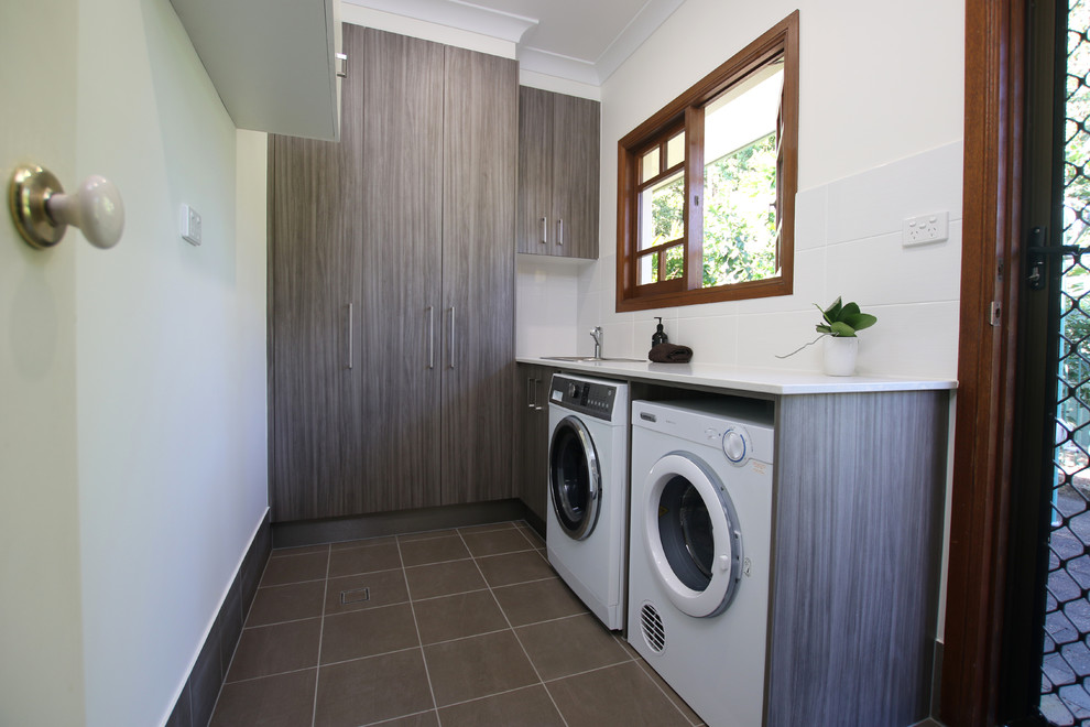 Transitional laundry room in Cairns.