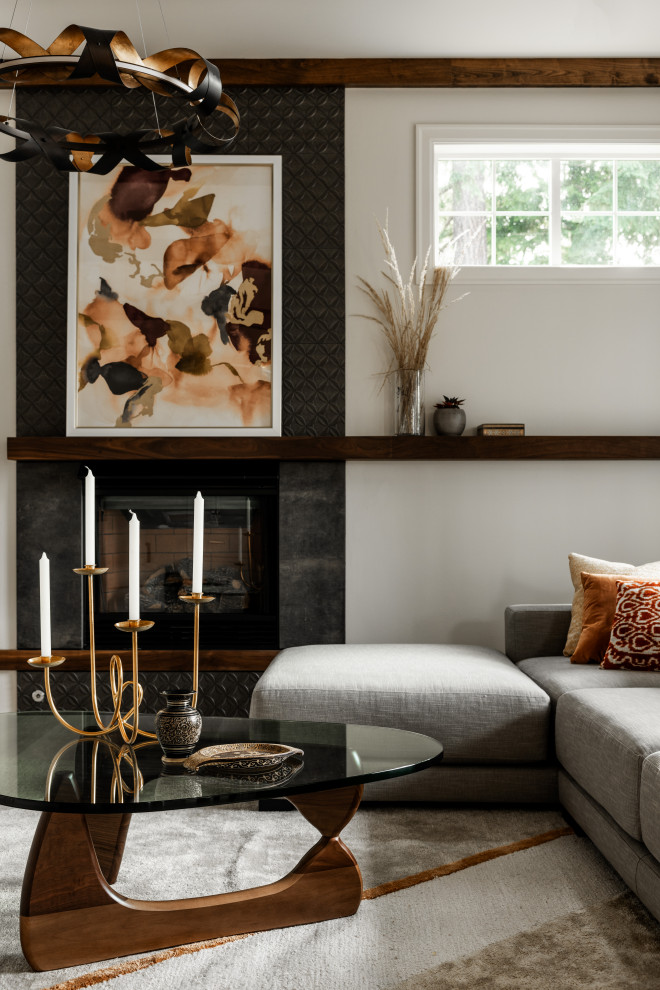 Inspiration for an expansive transitional formal open concept living room in Seattle with white walls, light hardwood floors, a standard fireplace, a tile fireplace surround, a built-in media wall, white floor and exposed beam.
