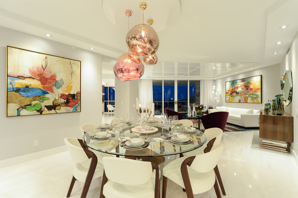 Expansive contemporary open plan dining in Miami with white walls, marble floors and white floor.