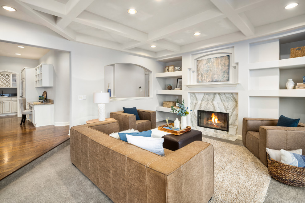 Inspiration for a large transitional open concept family room in Seattle with carpet, a standard fireplace, a stone fireplace surround and grey floor.