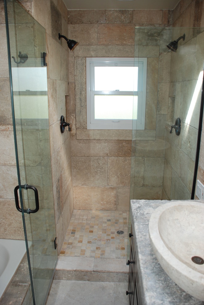 Photo of a small mediterranean bathroom in Orange County with beige walls and limestone floors.