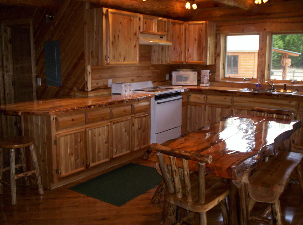Inspiration for a rustic eat-in kitchen remodel with medium tone wood cabinets