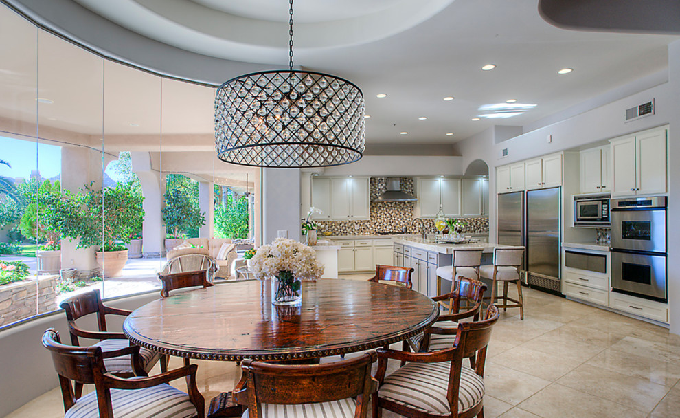 Example of a large transitional u-shaped travertine floor open concept kitchen design in Phoenix with an undermount sink, shaker cabinets, quartzite countertops, multicolored backsplash, mosaic tile backsplash, stainless steel appliances and an island