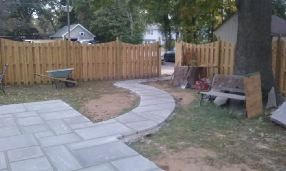 Bluestone patio wet lay with walkway and landscape