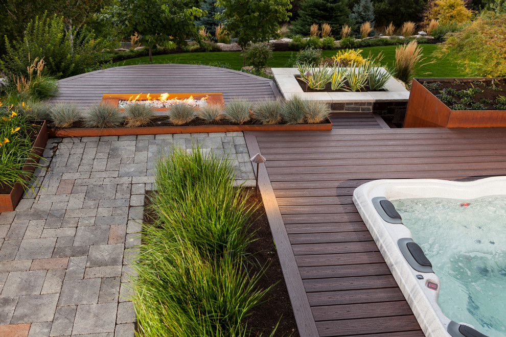 Mid-sized transitional backyard partial sun garden in Salt Lake City with a fire feature and decking for summer.