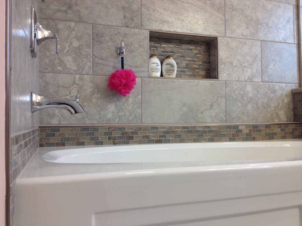 Inspiration for a mid-sized transitional kids' gray tile and porcelain tile porcelain tile alcove bathtub remodel with an undermount sink, raised-panel cabinets, white cabinets, granite countertops and orange walls