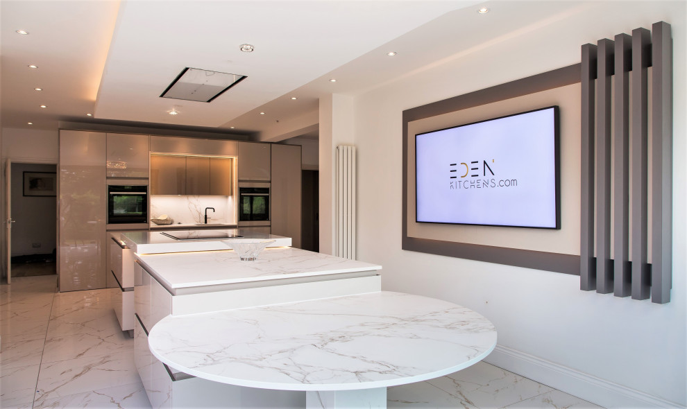 Large galley kitchen/diner in Essex with a built-in sink, flat-panel cabinets, composite countertops, white splashback, porcelain flooring, an island, multi-coloured floors, yellow worktops, a drop ceiling and feature lighting.