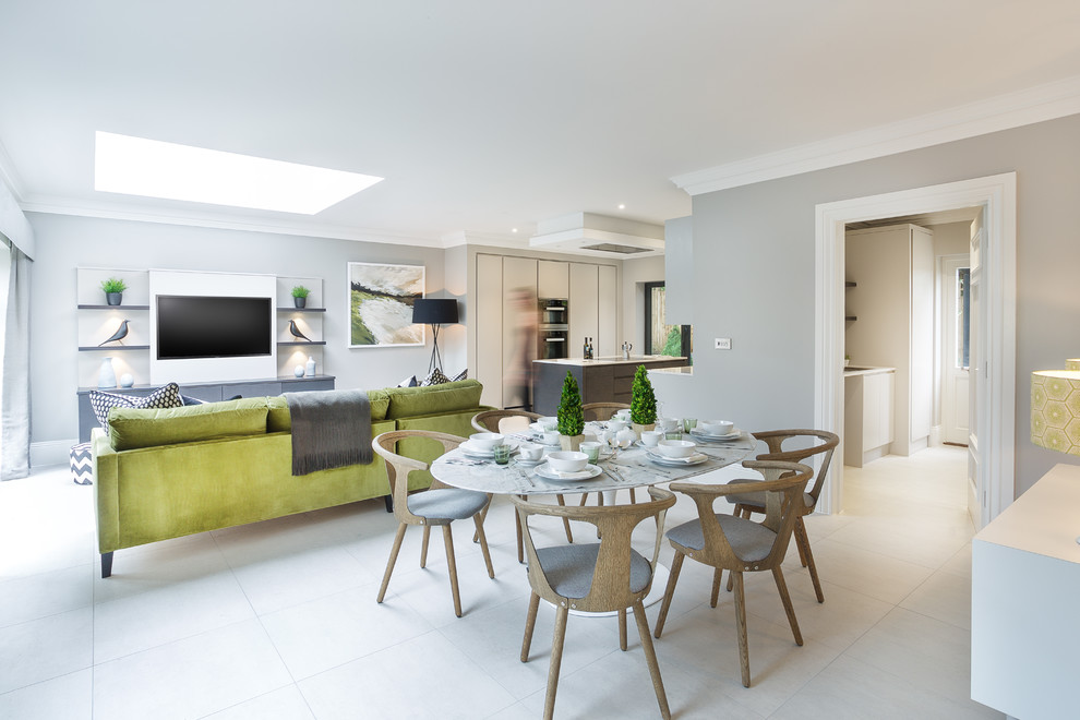 Photo of a contemporary open plan dining in Hampshire with ceramic floors, grey walls and white floor.