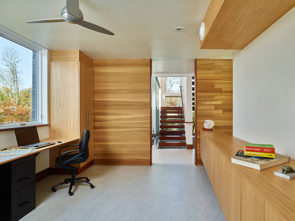 Contemporary home office in Philadelphia with a built-in desk.