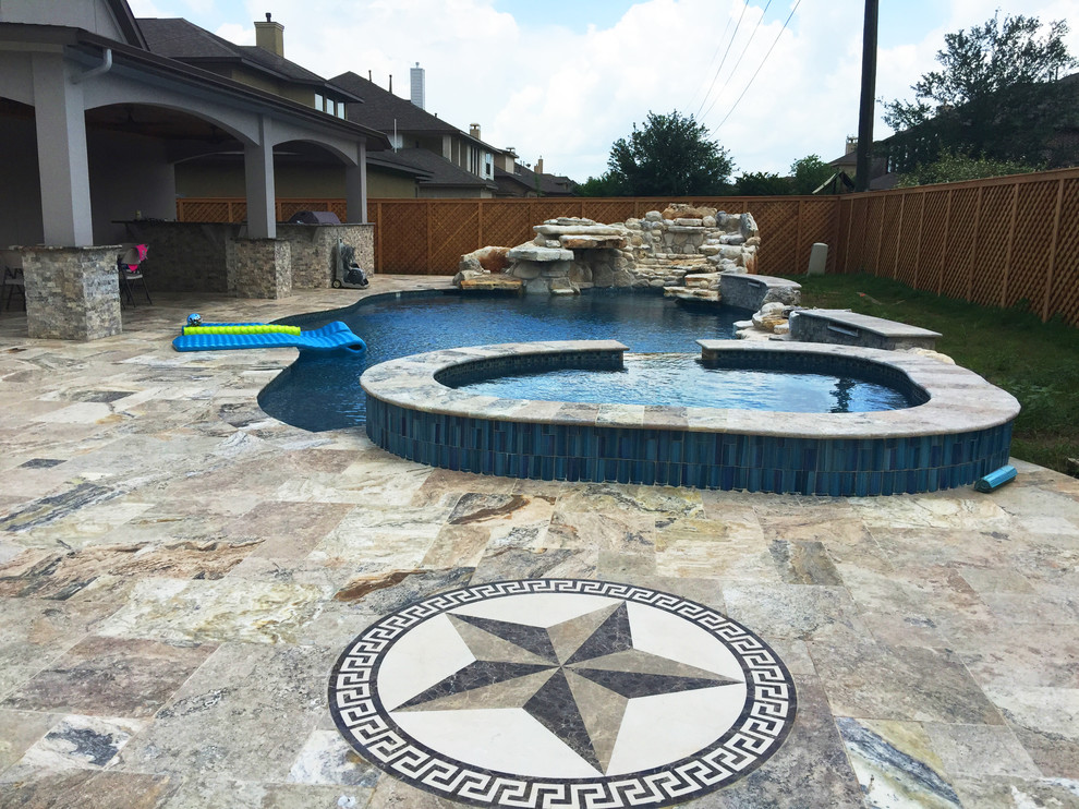 This is an example of a mid-sized transitional backyard custom-shaped lap pool in Orlando with a hot tub and tile.