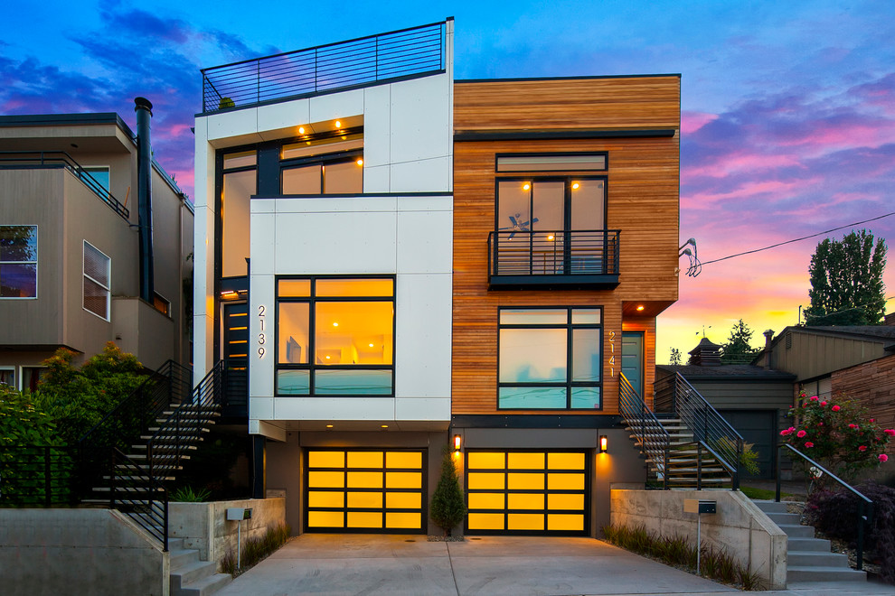Contemporary three-storey duplex exterior in Seattle with a flat roof.