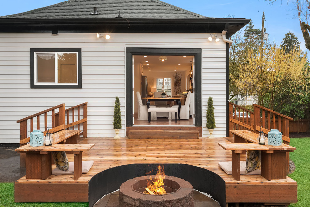 Inspiration for a transitional backyard deck in Seattle with a fire feature and no cover.