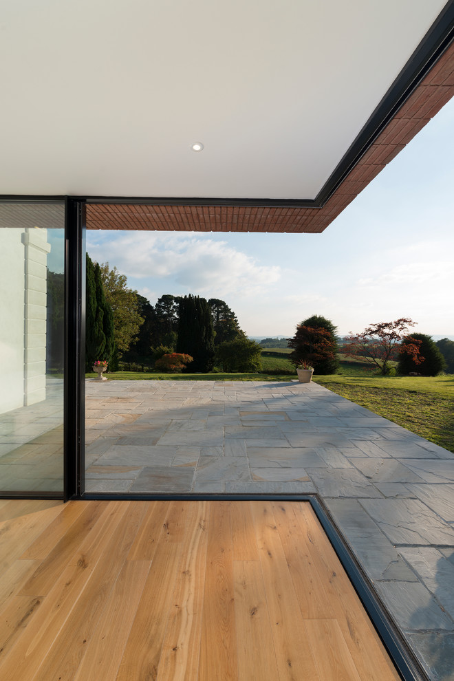 Design ideas for a contemporary patio in Devon.