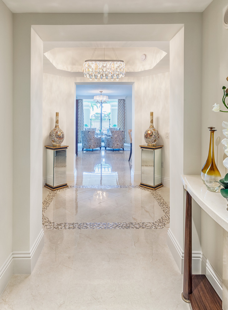 Design ideas for a large transitional foyer in Miami with white walls, marble floors, a double front door and a white front door.