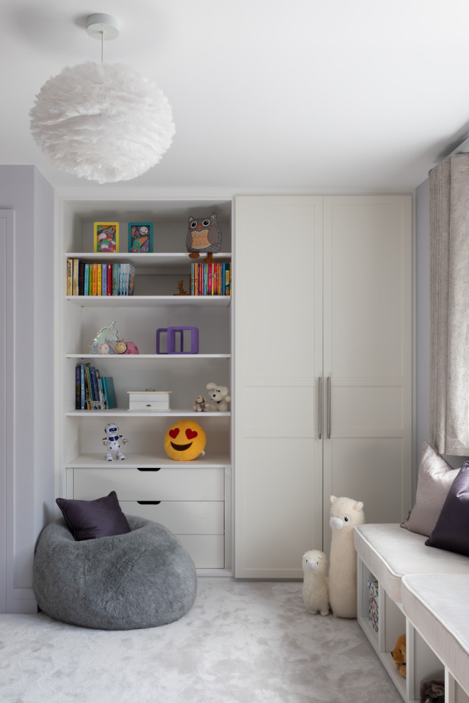 Design ideas for a mid-sized contemporary kids' room for girls in Hertfordshire with purple walls, carpet and grey floor.