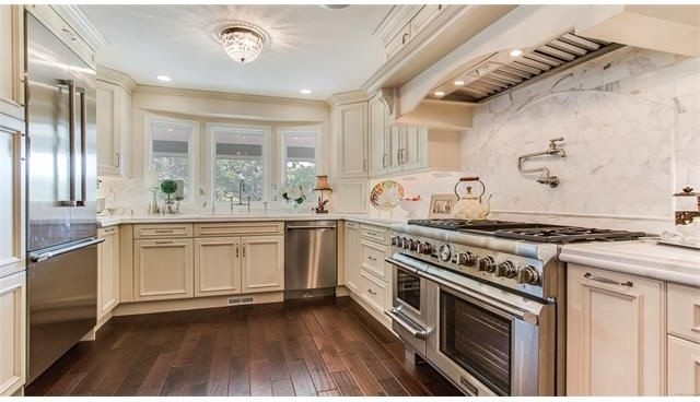 Example of a transitional kitchen design in Denver