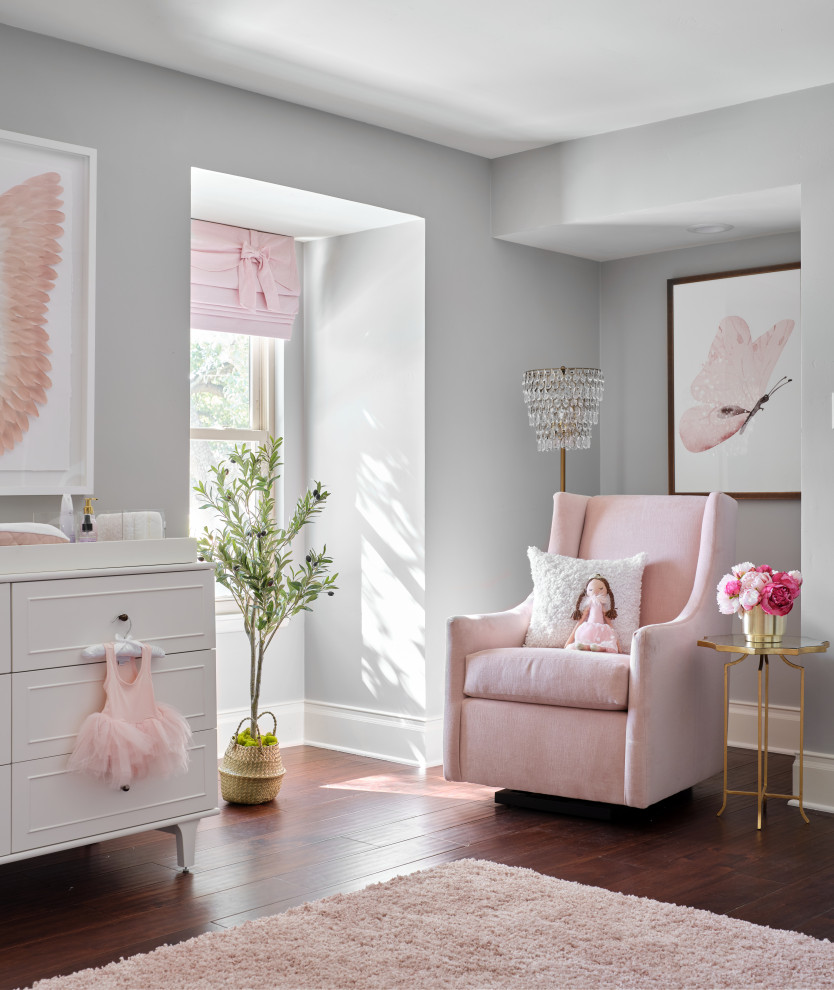 Shadylane Nursery- Design & Furnishings - Our team was thrilled to design and furnish a beautiful blush nursery for baby Sloan's imminent arrival.  The large scale rose wallpaper was the inspiration for the room's feminine design.  Pale gray walls provide a quiet backdrop to the patterned wallpaper.  Blush window treatments, crisp white furniture, and beautifully detailed children's artwork finish the space.  The natural light flooding through the windows provides a tranquil space for a newborn baby.
