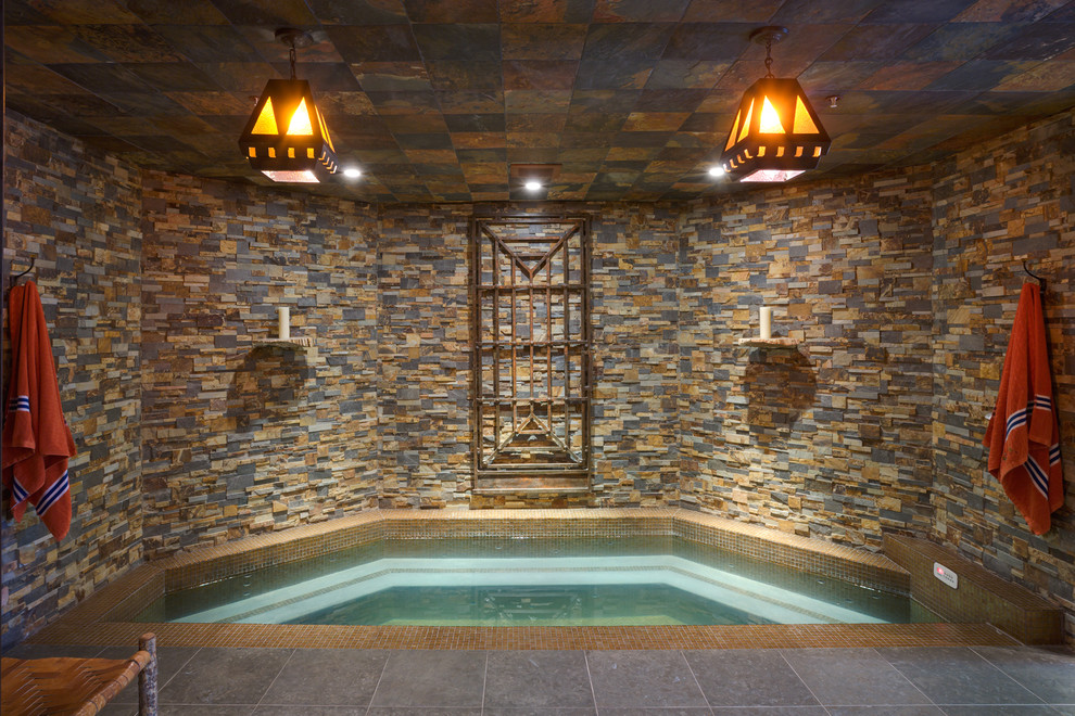Design ideas for a mediterranean indoor pool in DC Metro with a hot tub.