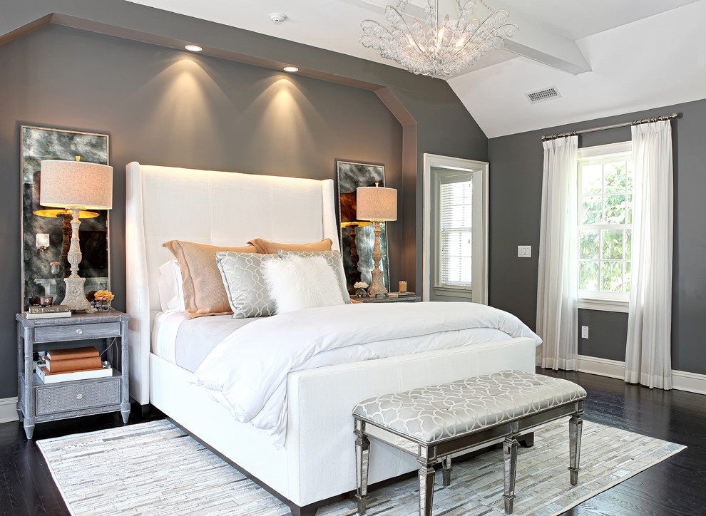 Mid-sized transitional master bedroom in New York with grey walls and dark hardwood floors.