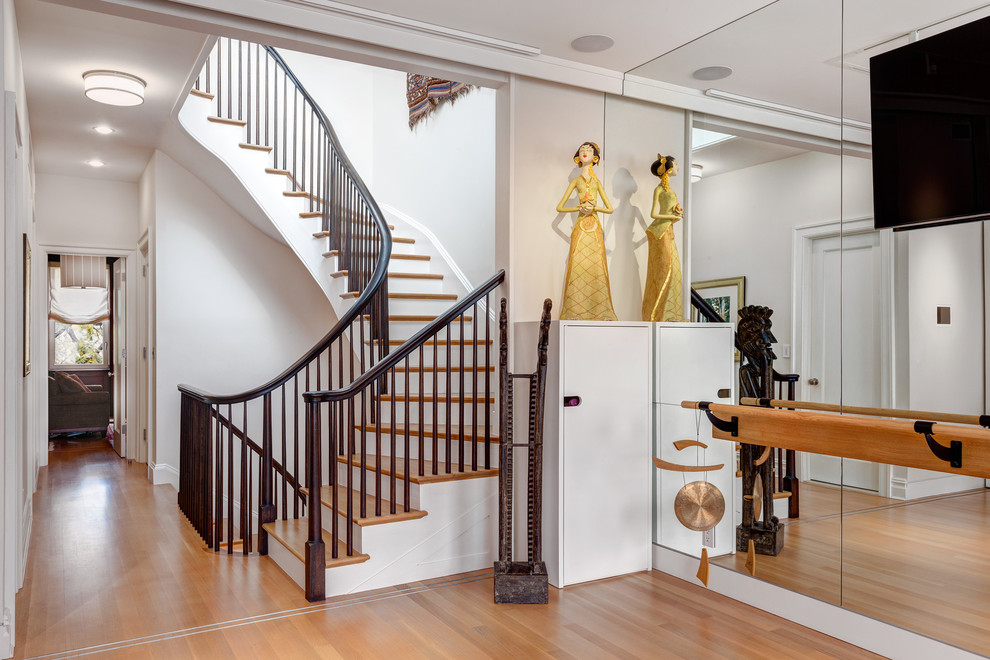 Inspiration for a large transitional wood u-shaped staircase in New York with painted wood risers.