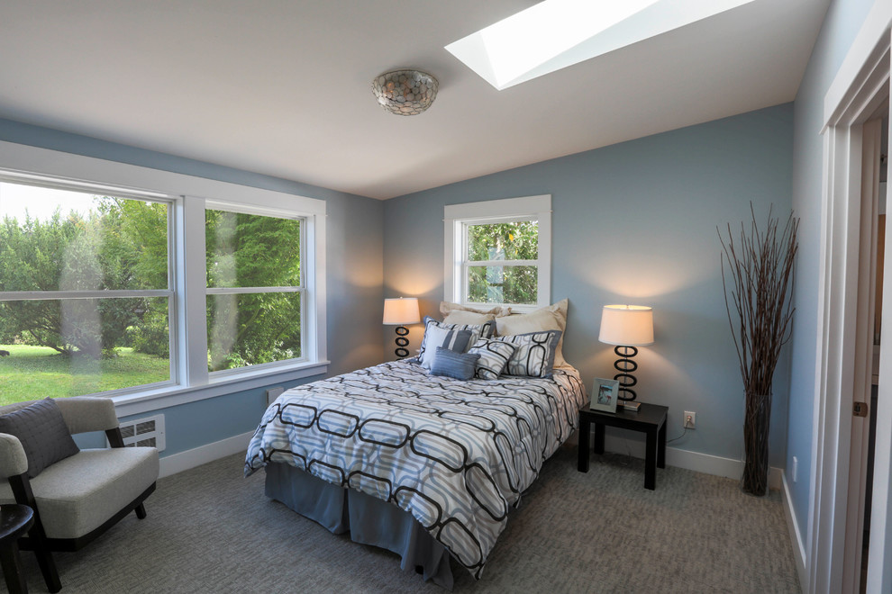 Design ideas for a mid-sized arts and crafts master bedroom in Seattle with blue walls, carpet, no fireplace and grey floor.