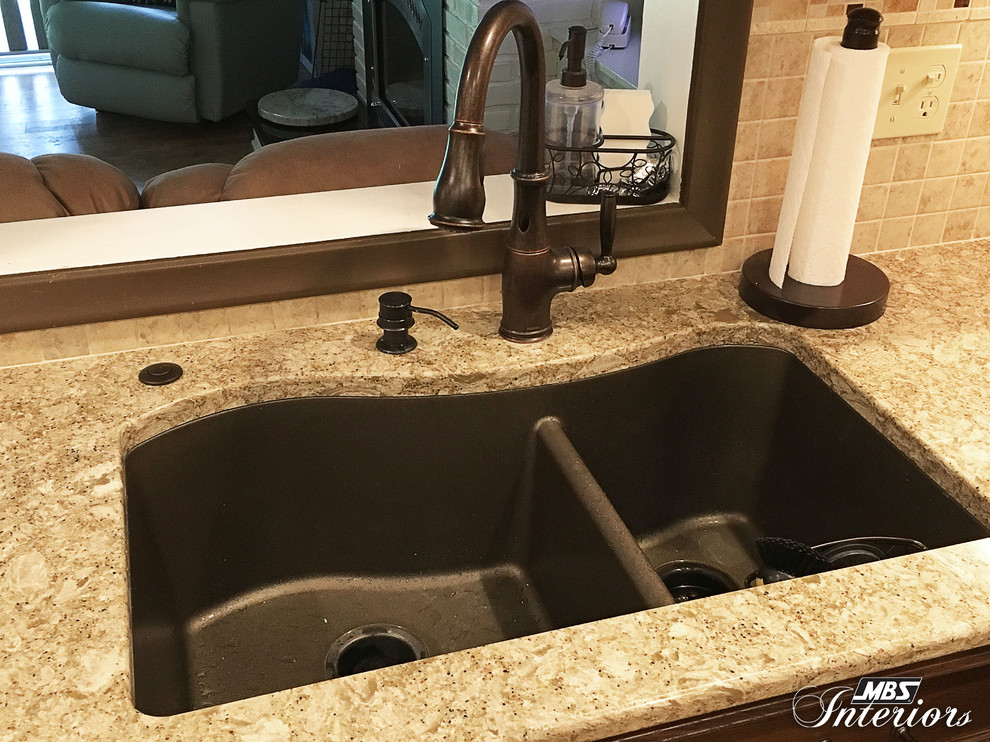 Inspiration for a small transitional u-shaped eat-in kitchen remodel with an undermount sink, recessed-panel cabinets, white cabinets, quartzite countertops, multicolored backsplash, mosaic tile backsplash, stainless steel appliances and no island