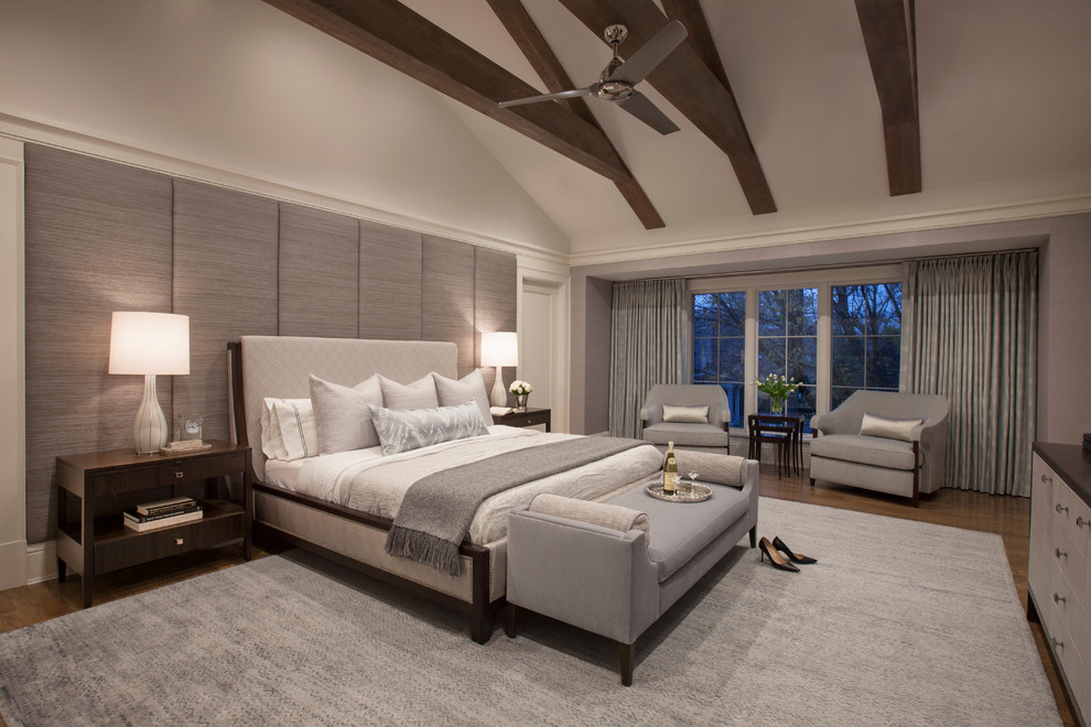 Photo of a transitional master bedroom in Chicago with white walls, dark hardwood floors and brown floor.